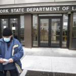 ACCESS DENIED: Visitors to the N.Y. Department of Labor are turned away at the door by personnel due to closures over coronavirus concerns on March 18. The coronavirus pandemic has hurt many households financially, but there are ways to get some relief. / AP FILE PHOTO/JOHN MINCHILLO