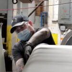 ON TASK: Art Levesque works on the coating line on third shift at Cooley Group in Pawtucket. / COURTESY COOLEY GROUP
