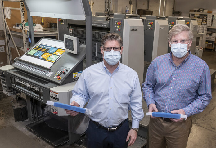 DIVERSIFIED: Kevin Sheahan, left, and David Sheahan are the owners of Sheahan Printing in Woonsocket, a multigenerational, family-owned printing company that has transitioned to making face shields. / PBN PHOTO/MICHAEL SALERNO