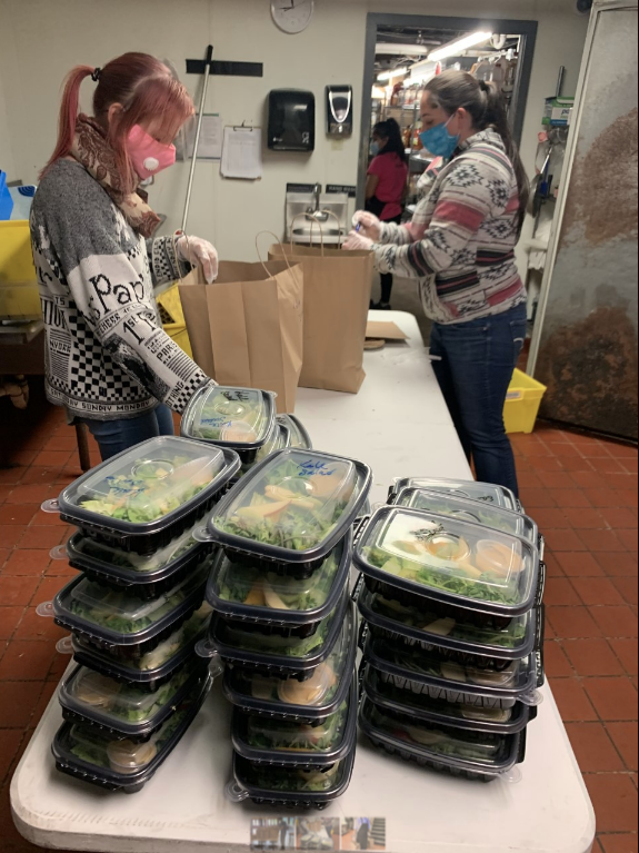 EMPLOYEES AT RED STRIPE restaurant in Providence organize meal packages to be delivered to Roger Williams Medical Center. Encore Restaurant Group and the Ocean State Job Lot Charitable Foundation recently launched its Meals with a Mission program where it will deliver close to 4,000 meals to frontline workers. / COURTESY ENCORE RESTAURANT GROUP
