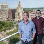 NEW MODEL: After working remotely due to the COVID-19 pandemic, Delin Designs CEO Eric Delin, left, and Digital Marketing Director Matt Smith decided not to return to in-office work and to perform all work remotely going forward. / PBN PHOTO/MICHAEL SALERNO