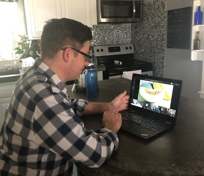PLAY TIME: Jeremy Girard, director of marketing at Envision Technology Advisors, participates in a trivia game from his home during the company’s “Friday Funday.” / COURTESY JEREMY GIRARD