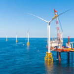 OPENING THE GATE: Deepwater Wind LLC completed the Block Island Wind Farm, pictured, in 2016. In June, the first utility-scale wind farm, an 84-turbine project called Vineyard Wind proposed off Martha’s Vineyard, received a favorable preliminary analysis from the Bureau of Ocean Energy Management, paving the way for future wind farms to begin ­spinning. / COURTESY DEEPWATER WIND LLC