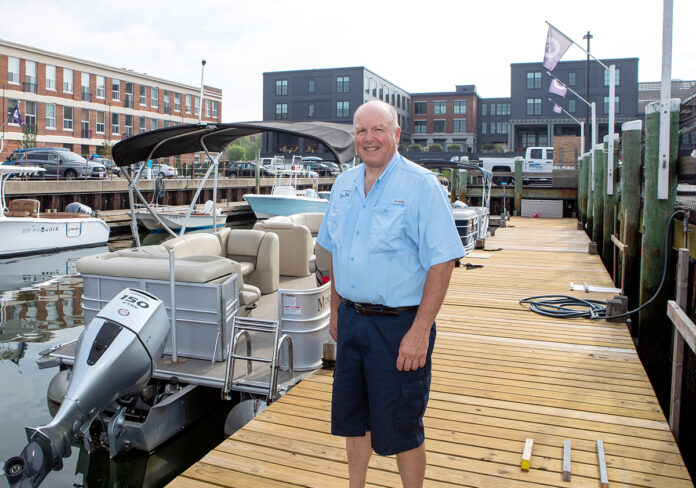 INCREASING NUMBERS: Richard Cromwell now has more than 400 members and a fleet of 70 boats throughout the four Freedom Boat Club franchises he owns in Rhode Island. He is pictured at the Newport club. / PBN PHOTO/KATE WHITNEY LUCEY