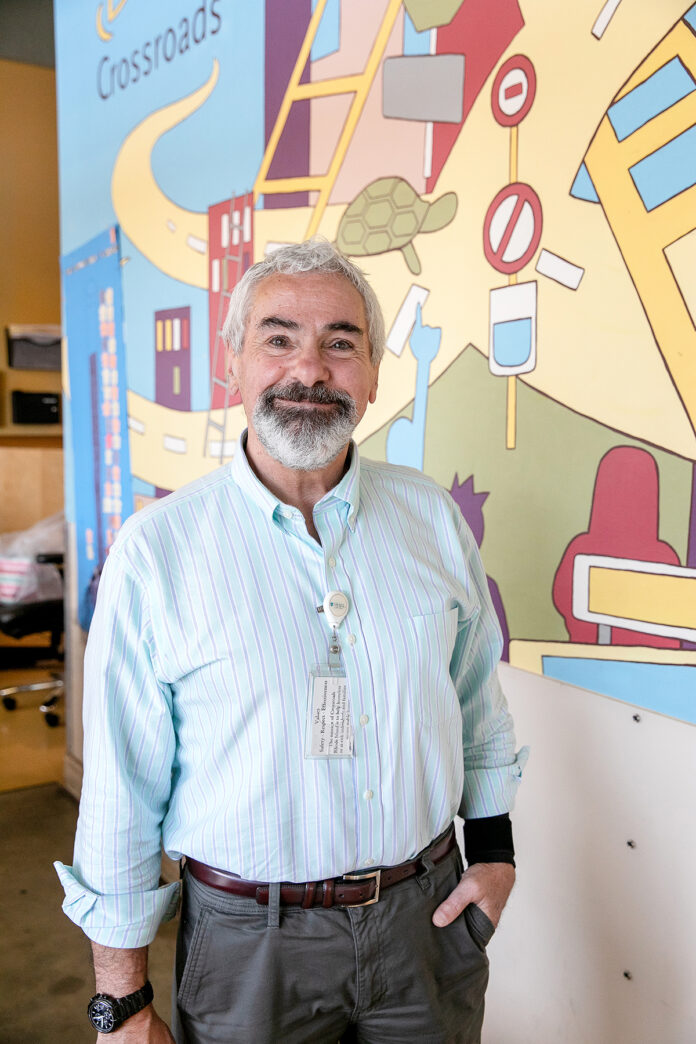 PREPARING FOR SUCCESS: Crossroads Rhode Island Vice President for Adult Services John MacDonald worked with staff to establish a human-resources training program designed to help new employees be successful.  PBN PHOTO/TRACY JENKINS