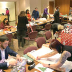 ULTIMATE GIFT: Skills for Rhode Island’s Future holds an annual holiday giving event, in which it selects a charity to support and employees wrap gifts for families and kids. COURTESY SKILLS FOR RHODE ISLAND’S FUTURE
