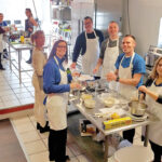 TASTY CUISINE: BankNewport employees take part in an Italian cooking class as part of a raffle prize for those who donated to the BankNewport 2019 United Way campaign. / COURTESY BANKNEWPORT