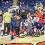 HOT WHEELS: Barnum Financial Group employees participate in the Foundation for Life’s Bikes for Kids program.  COURTESY BARNUM FINANCIAL GROUP