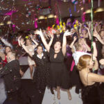 LIFE’S A PARTY:  Amgen Inc. employees dance together at a  recent annual gala. / COURTESY AMGEN INC.
