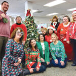 CHRISTMAS TIME: Employees at Carey, Richmond & Viking Insurance wear holiday outfits to get into the Christmas spirit.  COURTESY CAREY, RICHMOND & VIKING INSURANCE