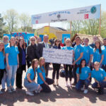 PLAY TIME: Navigant Credit Union employees help support Project Playhouse, which provides local children in need with brand-new, state-of-the-art playhouses. / COURTESY NAVIGANT CREDIT UNION
