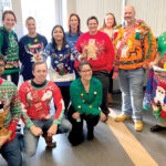 BEST-DRESSED: Rubius Therapeutics employees participate in a “Best Sweater” contest it held on behalf of the activities team in late 2019. It was accompanied by a “Giving Tree” for local families in need. / COURTESY RUBIUS THERAPEUTICS