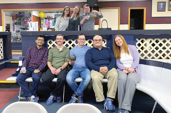 BIRTHDAYS AND BOWLING: Members of the Brave River Solutions Inc. team have fun with a celebration of January birthdays with some bowling.  COURTESY BRAVE RIVER SOLUTIONS INC. 