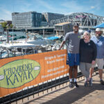 IN DEMAND: From left, Randall Ferdinand, Providence Kayak Co. employee; Kristin Stone, owner; and Tom McGinn, captain. The company, which was started three years ago, exploded in popularity this past summer, as people wanted to get outside. / PBN PHOTO/MICHAEL SALERNO 