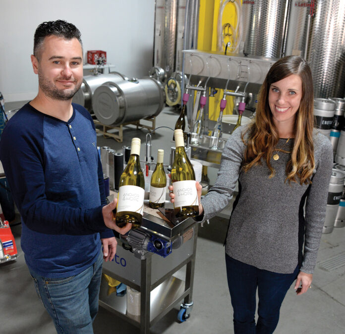 ALTERNATIVE PACKAGING: James Davids and Marissa Stashenko, co-owners of negociant winery Enotap LLC in East Providence, say using more-responsible packaging, such as cans and kegs, is better for the environment and costs less for consumers. / PBN PHOTO/ELIZABETH GRAHAM