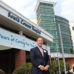 INDEPENDENT-MINDED: Aaron Robinson, CEO and president of South County Health, acknowledges that the COVID-19 pandemic has put a big strain on the small, independent health care company. / PBN PHOTO/ELIZABETH GRAHAM
