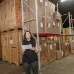 ON THE MOVE: Christine Crum, owner of Gentry Moving and Storage, makes her way around the company storage facility. / PBN PHOTO/MICHAEL SALERNO