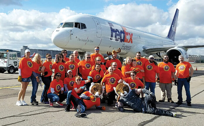 PULLING TOGETHER: Employees with Envision Technology Advisors LLC gather during their recent participation in the MS Jet Pull at T.F. Green Airport in Warwick. / COURTESY ENVISION TECHNOLOGY ADVISORS LLC