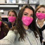 RHODE ISLAND MEDICAL IMAGING staff members model specially designed pink face masks that the organization sold to commemorate Breast Cancer Awareness Month. / COURTESY RHODE ISLAND MEDICAL IMAGING