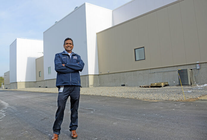 JOBS COMING: Amgen Rhode Island’s new biomanufacturing plant in West Greenwich is expected to add 150 high-paying jobs there. Pictured is Rohan Persaud, Amgen’s plant manager and executive director. / PBN FILE PHOTO/ELIZABETH GRAHAM