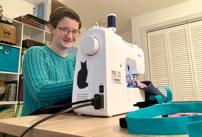 PERSONAL TOUCH: Diana Perkins created the LapSnap, a waterproof canvas bag, to allow wheelchair users to carry items when they go grocery shopping. She learned to sew so she could stitch 10 prototypes to send to test users. / COURTESY INCLUDESIGN LLC