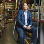 CLIMBING THE LADDER: Junior Jabbie started as an intern at Banneker Supply Chain Solution Inc. in North Smithfield in 2005. Now he is the company’s top executive. / PBN PHOTO/RUPERT WHITELEY