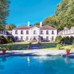STATELY SURROUNDINGS: The 9-acre Ker Arvor estate at 275 Harrison Ave., Newport, sold on Dec. 29 to a Silicon Valley tech executive and his wife, a novelist, for $7.3 million. / Courtesy Lila Delman Real Estate