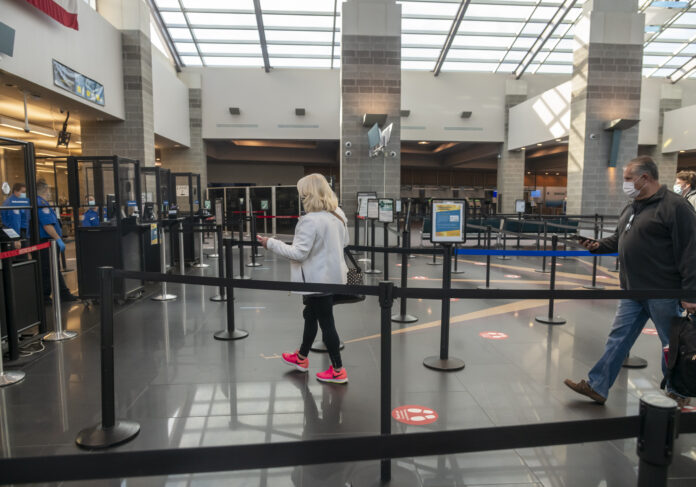 A FEW TRAVELERS make their way through the security line in the terminal at T.F. Green Airport. Airport officials hope legislation to change the name of the airport will help boost the number of passengers who come through the state's largest airport. / PBN FILE PHOTO/MICHAEL SALERNO
