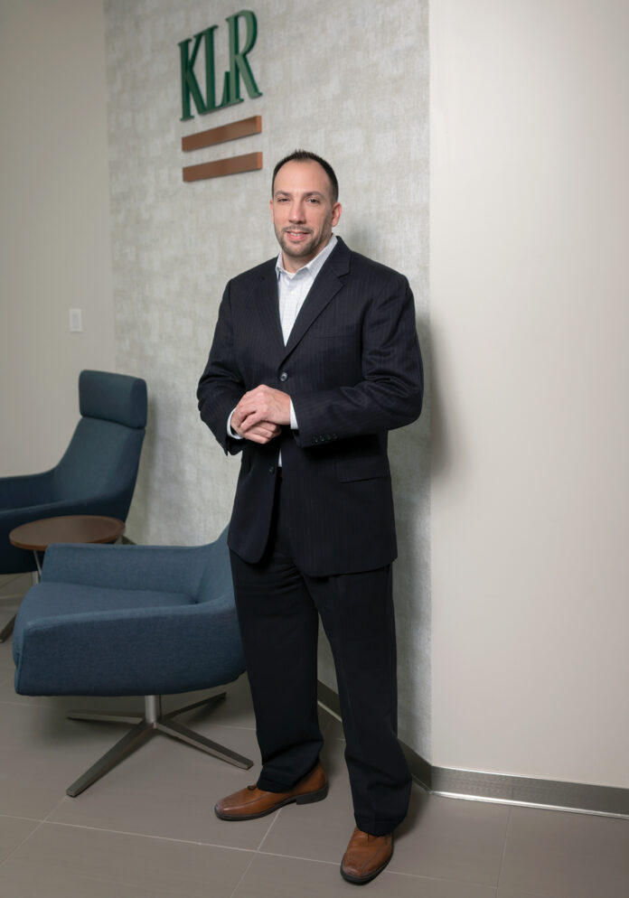 Anthony J. Mangiarelli has been with financial services firm Kahn, Litwin, Renza & Co. Ltd. for more than 20 years. He became a partner in 2015 and is KLR’s resident expert on the federal economic stimulus packages.   / PBN PHOTO/MICHAEL SALERNO