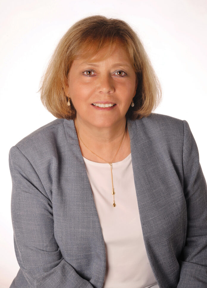 MAKING A DIFFERENCE: Phyllis Pelletier, chief financial officer of nonprofit Family Service of Rhode Island, says the example of giving back set by her father when she was young made a big impression on her and led to her wanting to work someplace where she could do the same. / COURTESY LUCA DEL BORGO