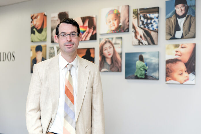 REACHING OUT: Edward McPherson, director of marketing and fund development for Newport Mental Health, says he was drawn to fundraising because it pairs people who can change the world with those people who need it. / PBN PHOTO/TRACY JENKINS