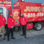 TEAM EFFORT: Junk King, located in Cranston, offers full-service furniture and appliance removal. From left, Matthew Rodriguez, manager, and owners Jose Martinez and Joel Martinez. PBN PHOTO/MICHAEL SALERNO