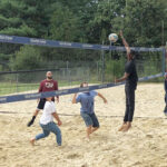 HAVING A BALL: The College Crusade of Rhode Island staff members face off in a volleyball game during Staff Appreciation Day at Mulligan’s Island in Cranston. / COURTESY THE COLLEGE CRUSADE OF RHODE ISLAND