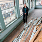 WORK SITE: Amy Grzybowski, future director of a planned higher education center in northern Rhode ­Island, visits the building in downtown Woonsocket that will be converted into the center by late 2021 or early 2022. / PBN PHOTO/MICHAEL SALERNO
