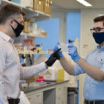 THE HEALING TOUCH: University of Rhode Island assistant professor Daniel Roxbury, left, and former URI graduate student Mohammad Moein Safaee display the “smart bandage” they spent two years developing. / COURTESY UNIVERSITY OF RHODE ISLAND