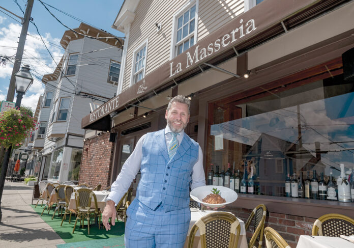 DECISION PAYING DIVIDENDS: Manny Tampella, manager of La Masseria restaurant in East Greenwich, says the Main Street eatery is experiencing its “best year ever,” helped in part by the traditionally dine-in restaurant’s decision to start offering takeout meals. / PBN PHOTO/MICHAEL SALERNO