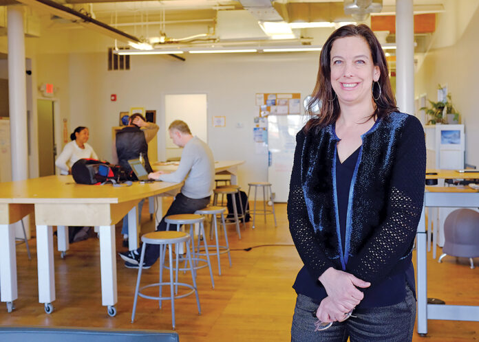 SMALL-BUSINESS STARTER: Providence-based Maternova Inc. was the first medtech venture to complete an accelerator program at Social Enterprise Greenhouse. The company’s founder, Meg Wirth, foreground, is now SEG’s director of health and wellness. / PBN FILE PHOTO/ELIZABETH GRAHAM