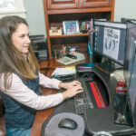 HERE TO STAY: Laura Yalanis, director of tax service for Kahn, Litwin, Renza & Co. Ltd., works in her home office in 2021. Some panelists believe remote work will become a permanent benefit offered by many local companies. PBN FILE PHOTO/MICHAEL SALERNO