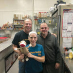 LOYAL STAFF: Tom Quinn, left, proprietor of The Hungry Monkey in Newport, says he’s grateful for his loyal staff who continued to come in to work throughout the COVID-19 pandemic. Standing with Quinn are wait staff member Leigh Ann Ford, who is holding “Socks The Hungry Monkey,” and chef Shawn Powers. / COURTESY THE HUNGRY MONKEY