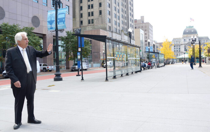 THE R.I. DEPARTMENT OF TRANSPORTATION will present three options for a Providence bus hub in a series of public hearings. Pictured is RIDOT Director Peter Alviti Jr. in Kennedy Plaza, where the bus depot is currently located. / PBN PHOTO/ELIZABETH GRAHAM