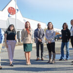 INCLUSIVE LEADERSHIP: AAA Northeast diversity and inclusion leaders gather outside their Providence headquarters. They are, from left, Robert Conners, travel agent; Isabel Stewart, project coordinator; Catherine Mendez, web content strategist; Randy Delgado, senior vice president of strategy and innovation; Sarah Palmer, project specialist; Karen Diehl, senior employee experience specialist; Djelisa Daveiga, lead insurance processor; and Donna Goncalves, human resources manager. / PBN PHOTO/ELIZABETH GRAHAM