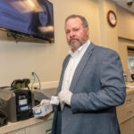 IN THE CARDS: Navigant Credit Union offers “instant issue” banking cards to members at its branches, but Timothy J. Draper, senior vice president of marketing, says Navigant and other financial institutions have seen shipments of new cards from vendors slow because of a chip shortage. / PBN PHOTO/MICHAEL SALERNO