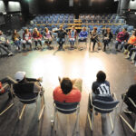 PERFORMANCE SETTING: Wheaton College students gather in a group to discuss one-minute plays inside a performing arts center at the Norton-based liberal arts college. / COURTESY WHEATON COLLEGE