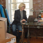 SUSAN MOCARSKI, owner and principal designer of Providence-based Cleverhood LLC, is eager to make trips overseas again so the company can better connect with distributors and large retailers in markets where Cleverhood's outerwear is already popular. / PBN FILE PHOTO/ELIZABETH GRAHAM