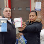 AID ­AVAILABLE: Pawtucket Emergency Medical Services Director Lance Dumont and Elizabeth Moreira, the city’s public health and equity leader, hold kits containing naloxone and fentanyl testers at the Newport Avenue fire station, which became a Safe Station for people seeking help with drug addiction. PBN PHOTO/ELIZABETH GRAHAM
