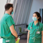 TRAINING DAYS: Brown University medical students Anthony Formicola, left, and Thi My Linh Tran talk while on duty on the labor and delivery floor at Care New England Health System’s Women & Infants Hospital in Providence.  / COURTESY CARE NEW ENGLAND HEALTH SYSTEM/RYAN PICKERING