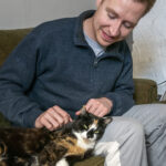 IN THE FAMILY: Bradly VanDerStad says he wanted to avoid having to make a difficult financial choice when it came to his cat, Sylvia, so he purchased health insurance for her. / PBN PHOTO/MICHAEL SALERNO
