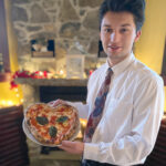 DISH IN DEMAND: Server William Fitzgerald of Imbriglio’s Pizzeria Napoletana in Newport shows off a popular item on the recent Valentine’s weekend menu. / COURTESY SARDELLA’S