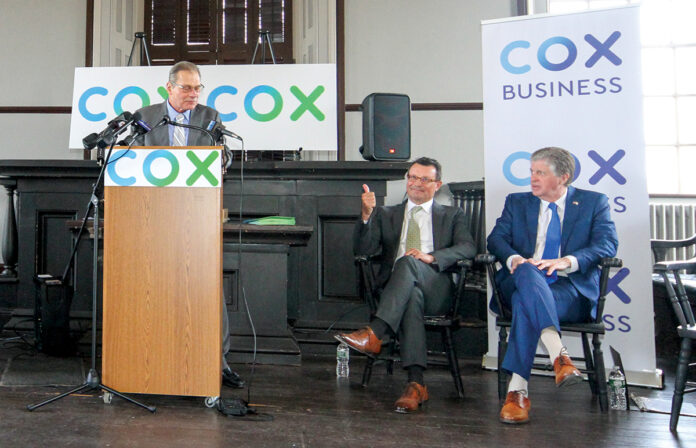 THE BIG REVEAL: Senate President Dominick J. Ruggerio speaks at an event in Newport on March 15 announcing Cox Communication Inc.’s $120 million investment to upgrade broadband infrastructure statewide. Also pictured, from left, are Ross Nelson, Cox senior vice president and region manager; Mark Greatrex, Cox president; and Gov. Daniel J. McKee. / COURTESY COX COMMUNICATIONS INC.