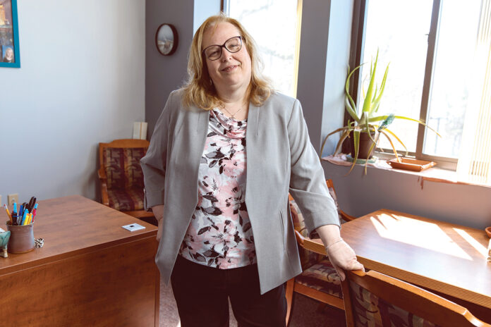 GOING STRONG: As chief financial officer at The Fogarty Center, Michelle Brodeur has displayed leadership skills, commitment and vision “that is truly the strength of the Fogarty Center,” says CEO David Reiss.   PBN PHOTO/RUPERT WHITELEY
